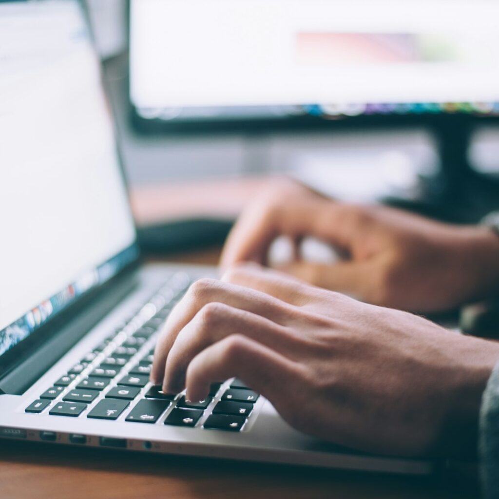 Person searching on a laptop