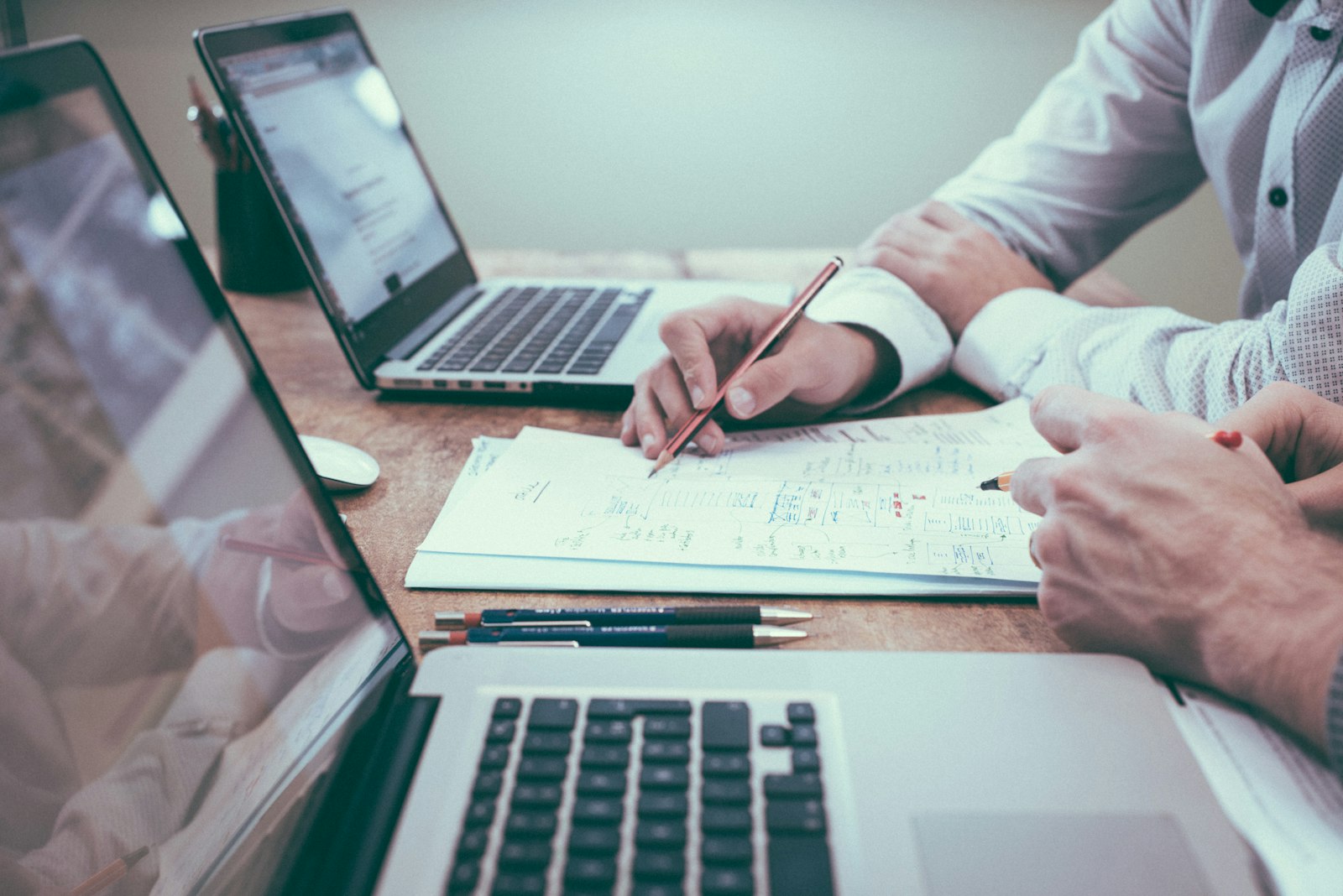 Planning a website budget with charts and a laptop