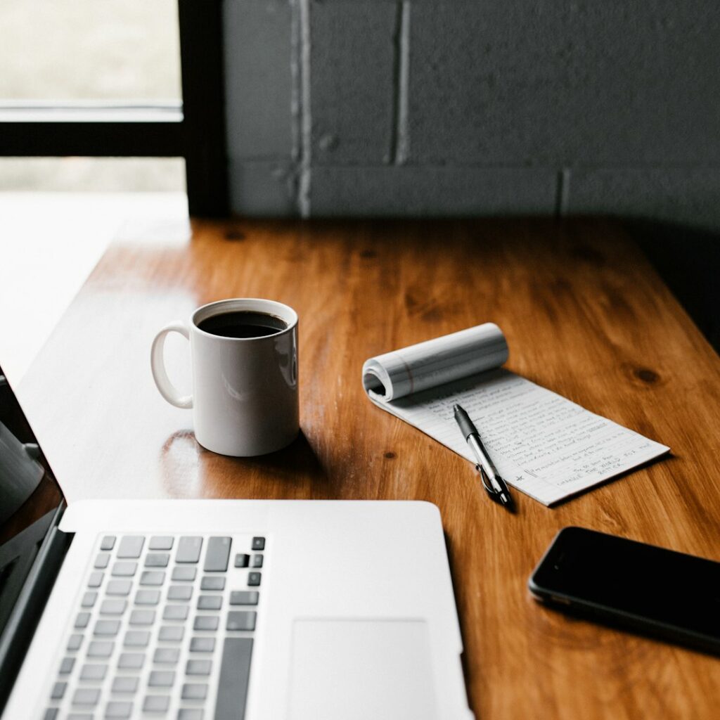 Writing website content on a laptop
