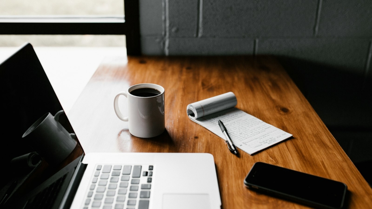 Writing website content on a laptop