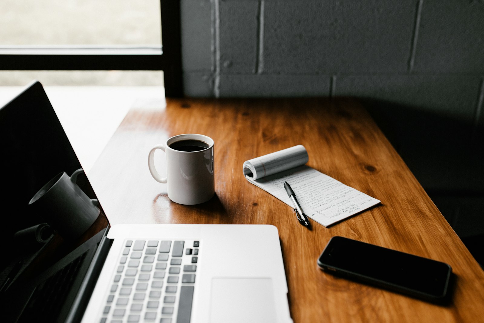 Writing website content on a laptop